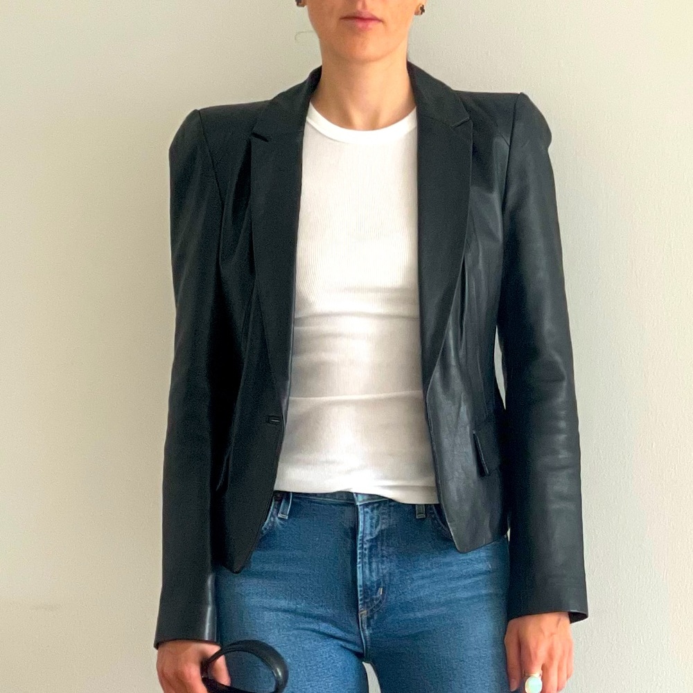 Leather jacket, shoulder detail, front button closure,